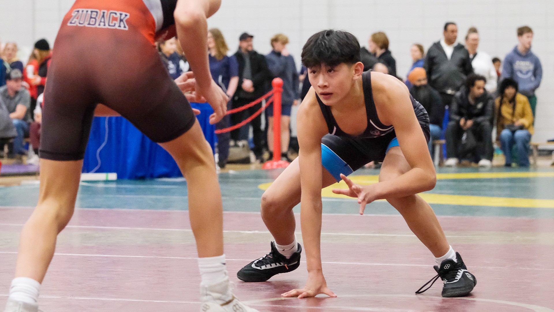 Ethan Chen wrestling at a tournament